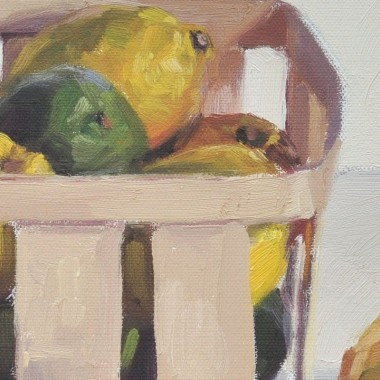 Citrons jaunes et verts dans une cagette